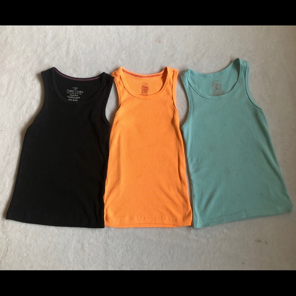 Three Faded Glory tank-tops
